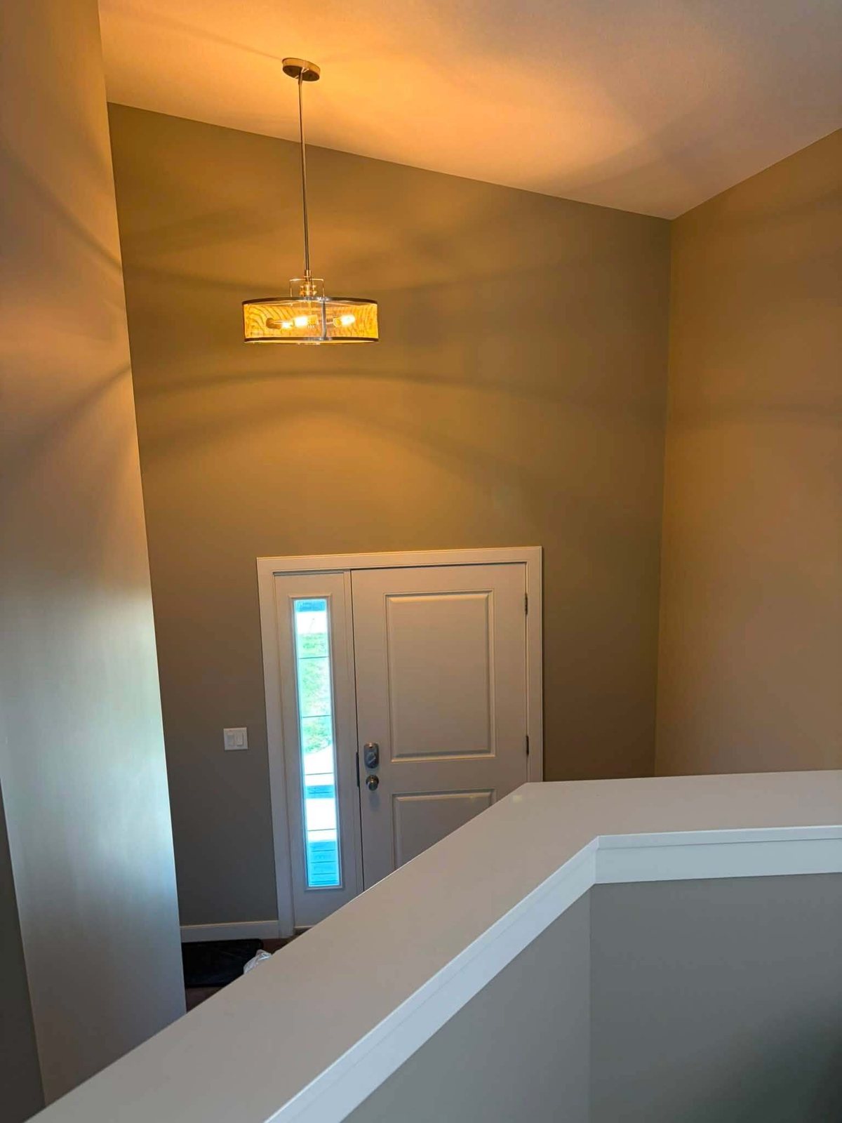 Entryway and front door with fresh wall paint