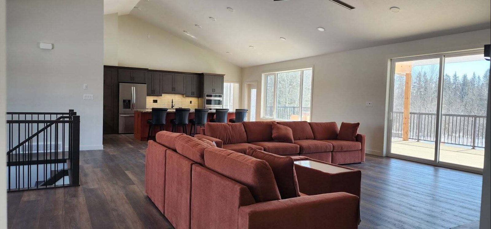 Great room with vaulted ceilings in a new Lacombe County home painted by Precision Paint