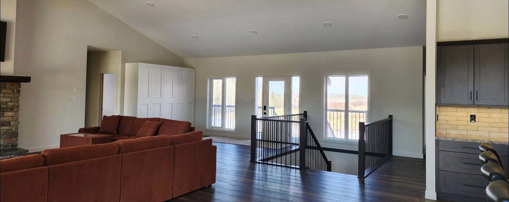 Great room looking toward the windows, with fresh paint on every wall